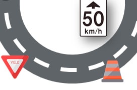 A sharp turn in the road with speed limits